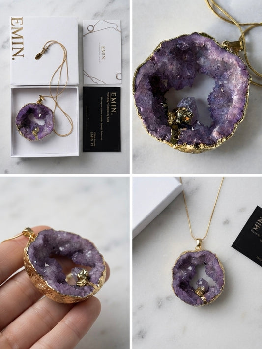 Amethyst geode necklace on gold snake chain, marble background