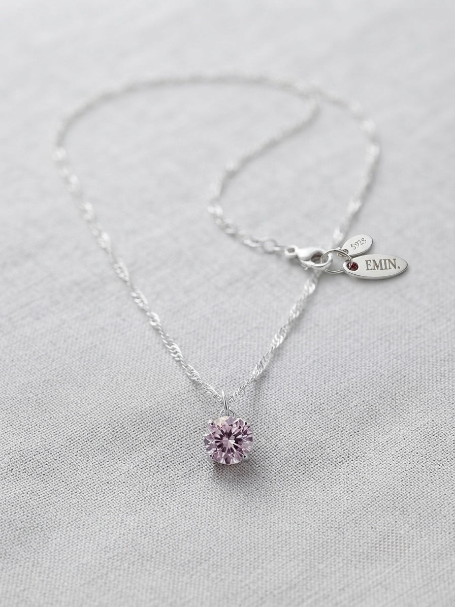 Moissanite pendant necklace flat lay
