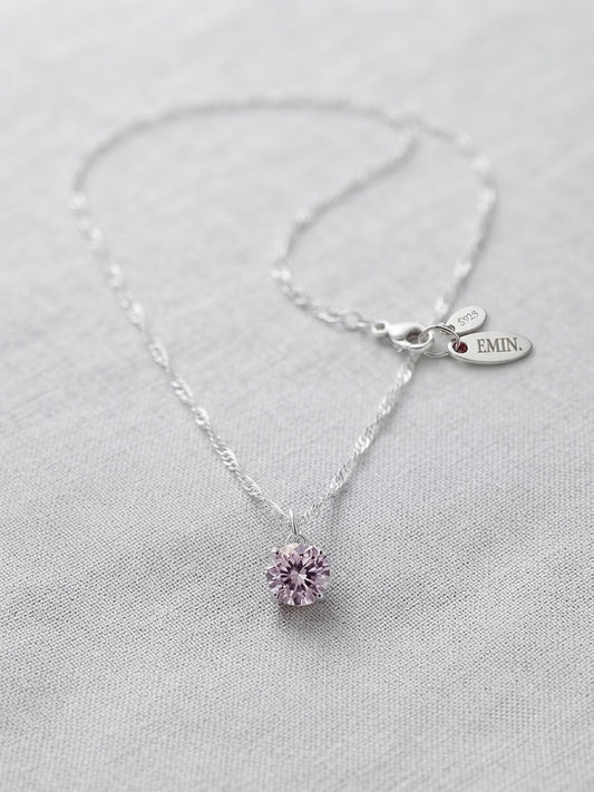 Moissanite pendant necklace flat lay