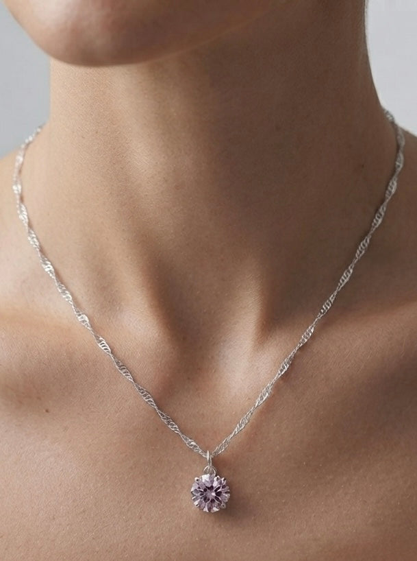 Moissanite pendant necklace worn on neck
